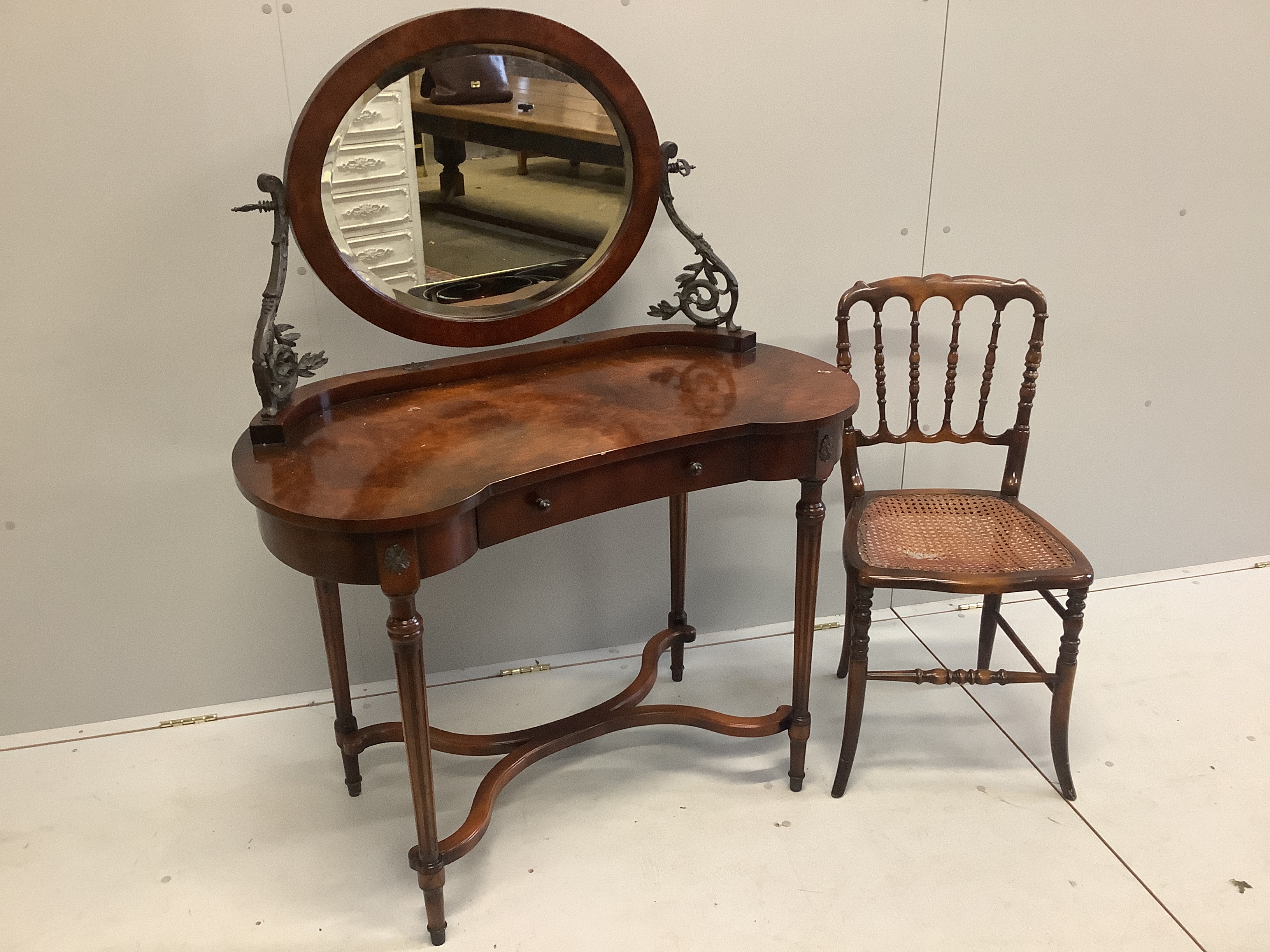 A Theodore Alexander bird's eye maple Empire style kidney shaped dressing table, width 100cm, depth 52cm, height 132cm and a cane seat chair
